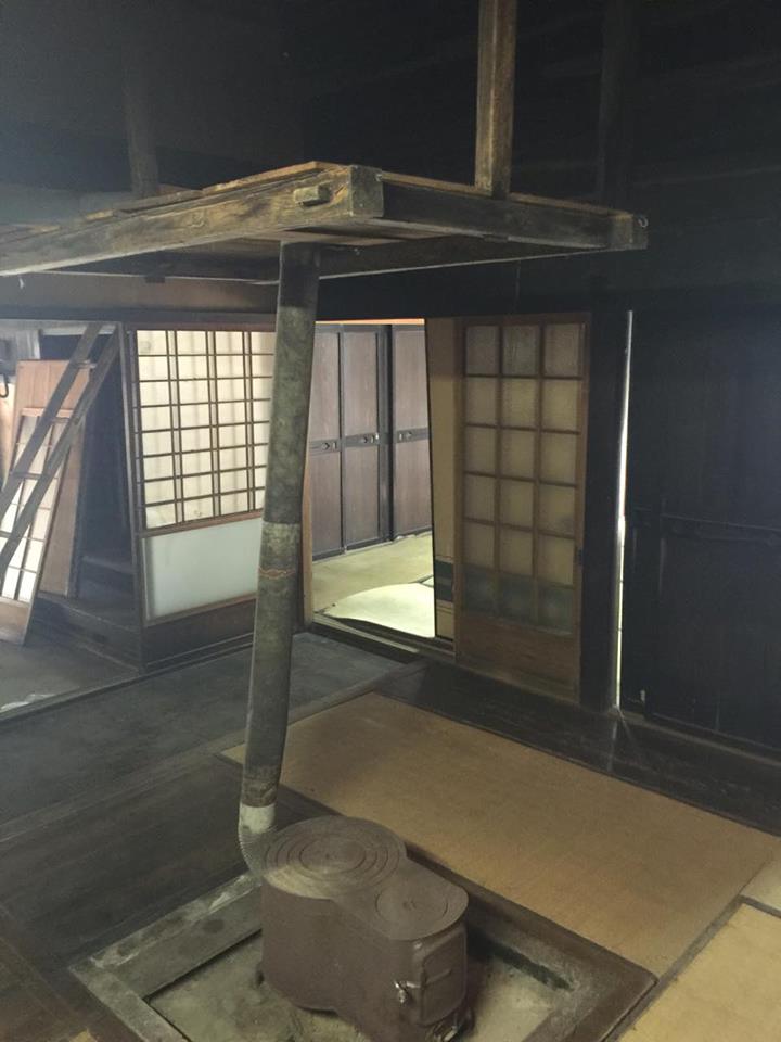 main-room-old-stove-over-irori-with-east-bedroom-and-doma-visible